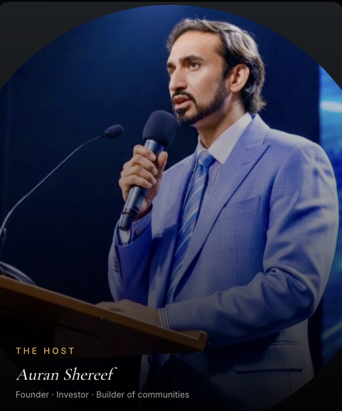 Auran Shereef speaking on stage